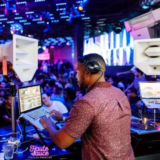deejaypryme playing to a packed club room from the DJ booth