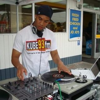 deejaypryme in a KUBE 93 FM shirt DJing an outdoor event