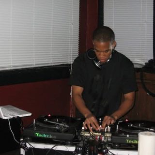 deejaypryme mixing on Technics turntables at an early gig